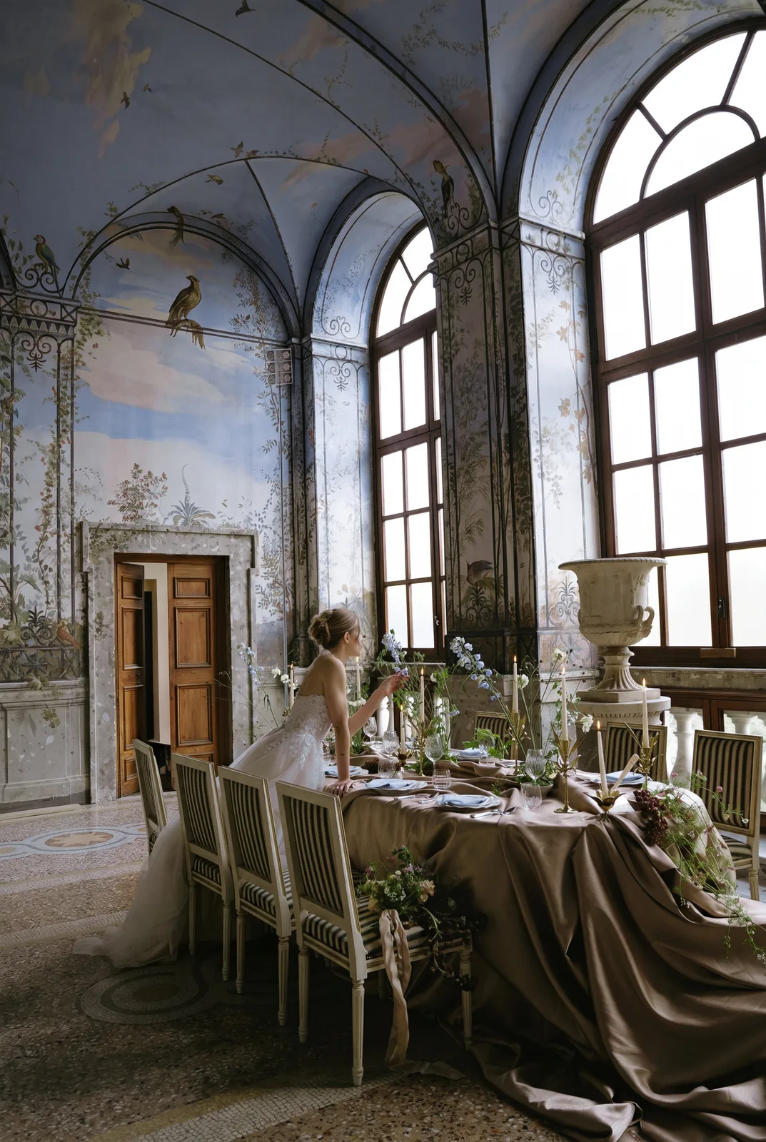 Bride at a table draped in bronze silk in the frescoed Salone d'Estate of Palazzo Chigi, Ariccia